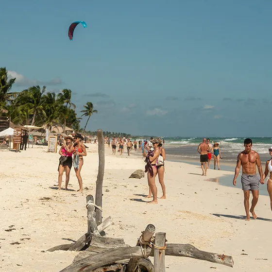 Golden-hour crowd at a Tu Brunch day party in Tulum